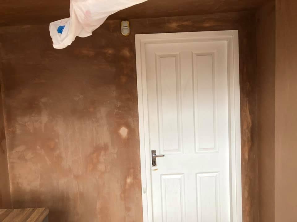 Kitchen wall drying beside a white panelled door